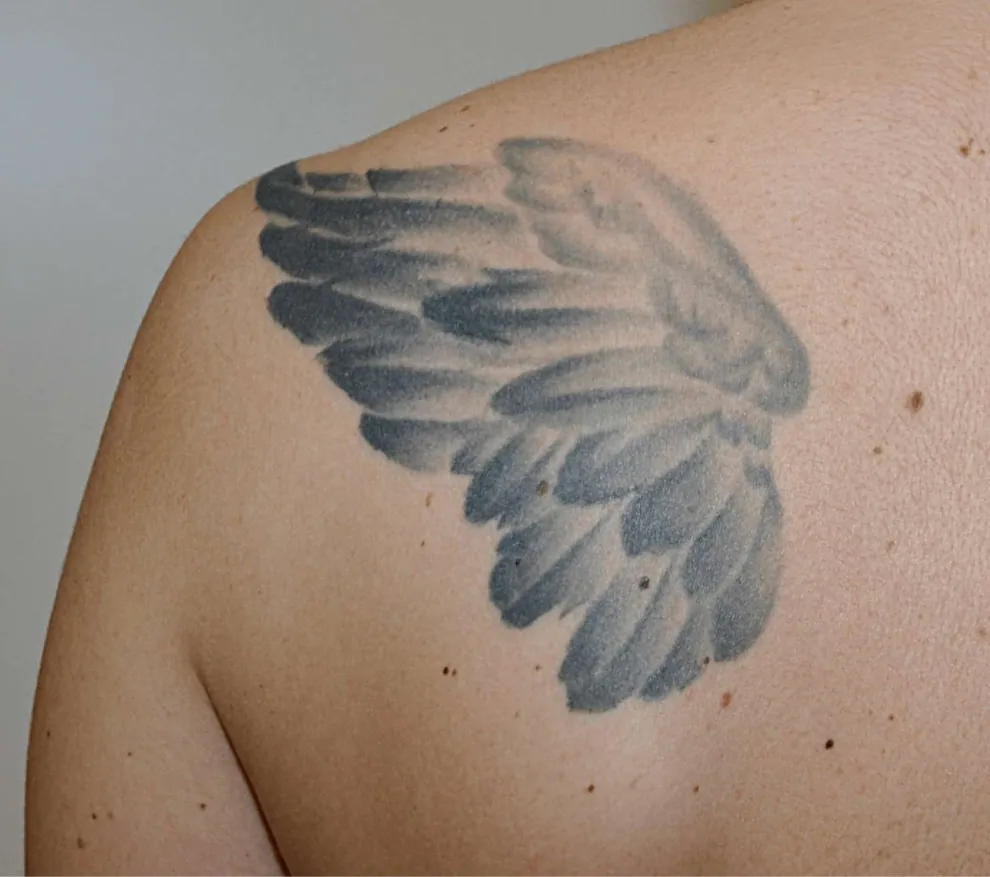 Wing tattoo on a shoulder blade